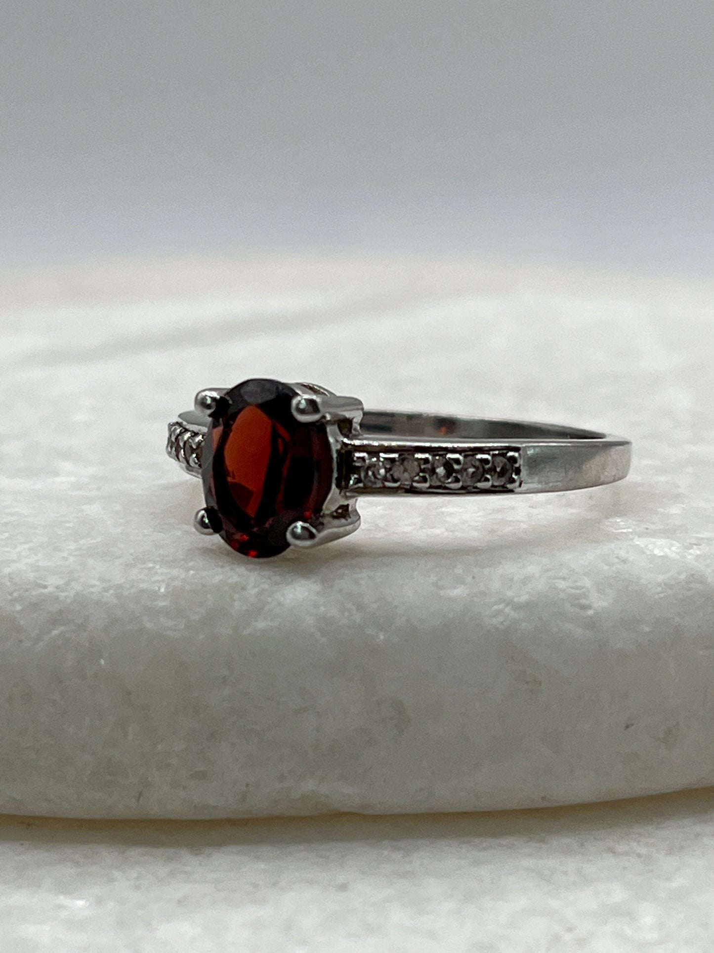 925 Sterling Silver Garnet Ring with White Topaz Shoulders - Size S