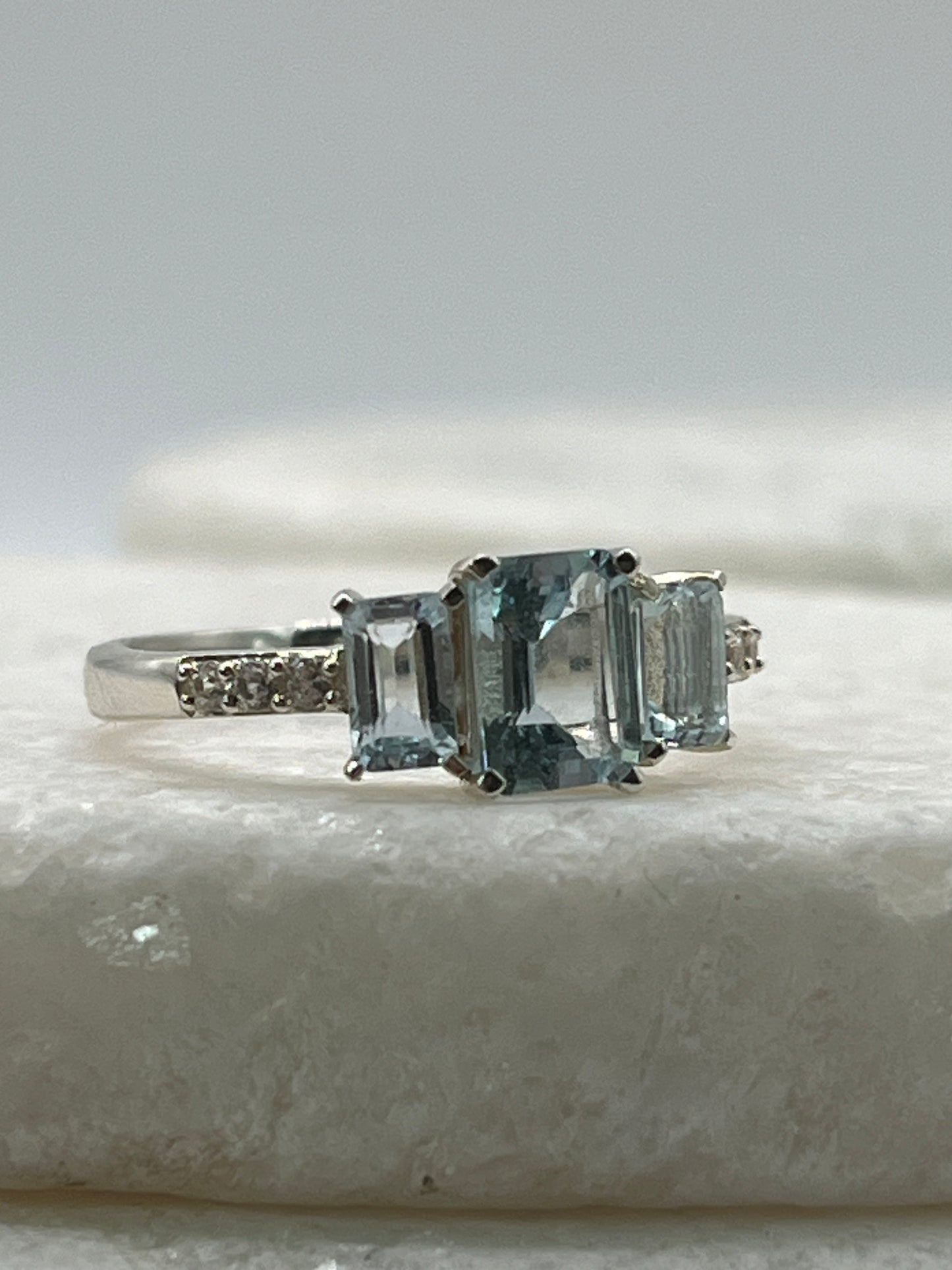 925 Sterling Silver Emerald Cut Aquamarine Trilogy Ring With White Topaz - Size Q