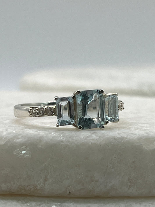925 Sterling Silver Emerald Cut Aquamarine Trilogy Ring With White Topaz - Size Q