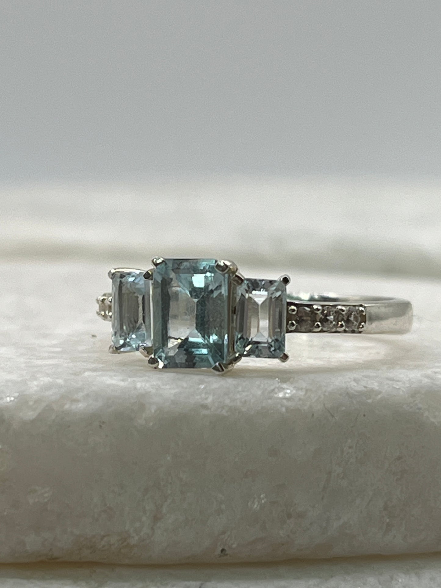 925 Sterling Silver Emerald Cut Aquamarine Trilogy Ring With White Topaz - Size Q