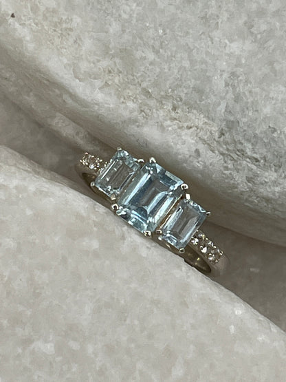 925 Sterling Silver Emerald Cut Aquamarine Trilogy Ring With White Topaz - Size Q